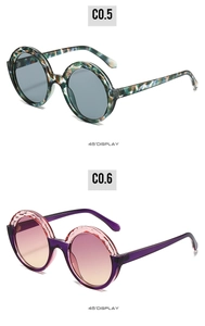 Detailed 45-degree view of retro round sunglasses with camouflage and purple frames