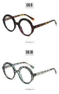 Detail view of round sunglasses in tortoiseshell and marble patterns at 45 degree angle