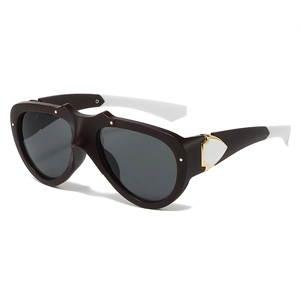 Retro butterfly cat-eye sunglasses with dark brown frame and black-white contrast temples