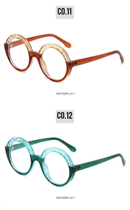 Detail of round eyewear frames in amber and teal with unique textured upper rims
