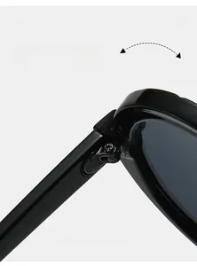 Detail of durable reinforced metal hinge on black round frame sunglasses for smooth folding