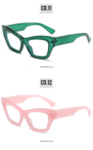 Cat eye glasses frames in transparent green and pink shown from a 45-degree angle