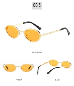 Detail view of oval metal sunglasses with orange lenses and gold textured frames