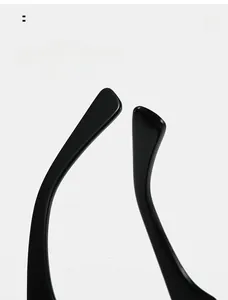 Close-up of curved ergonomic black temple arms on fashion cat-eye sunglasses for comfort