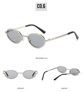 Detail view of oval metal sunglasses with silver glitter texture and light gray lenses