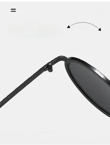Detail of durable textured metal hinge on black oval vintage sunglasses with dark lenses