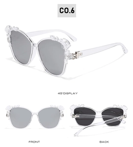 Three-way view of cat eye sunglasses with grey lenses and crystal flower details