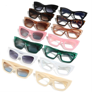 Collection of cat-eye sunglasses and frames in various colors with a glossy finish