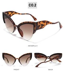 Detail view of leopard print oversized cat-eye sunglasses with gradient brown lenses
