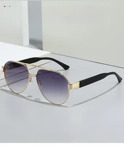 Detail of gold metal double bridge aviator sunglasses with purple gradient lenses