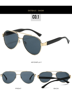 Detail of pilot sunglasses with gold metal frame, dark lenses and three viewing angles