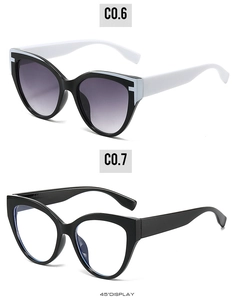 Cat eye sunglasses detail showing black and white frames with gradient purple lenses