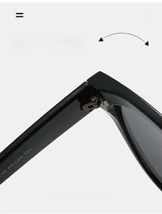 Detail shot of durable metal hinge and size dimensions on black cat eye sunglasses