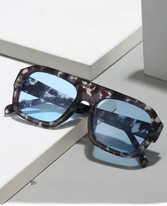 Detail of square oversized tortoiseshell glasses with blue light blocking lenses