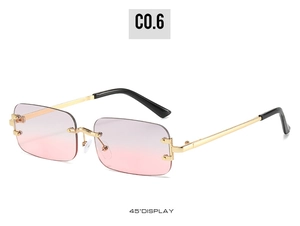 Detail of rimless rectangle sunglasses with pink gradient lenses and gold metal temples