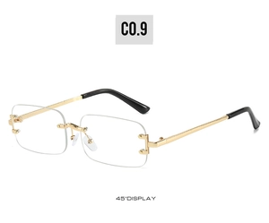 Detail view of rimless rectangular sunglasses with gold metal temples at a 45-degree angle