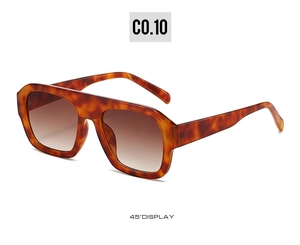45-degree view of oversized tortoiseshell sunglasses with brown gradient lenses
