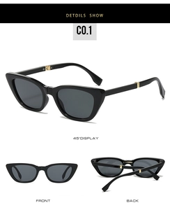 Macro view of foldable black cat-eye sunglasses with gold metal temple details