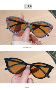 Detailed view of cat eye sunglasses with colorful rhinestones and amber lenses