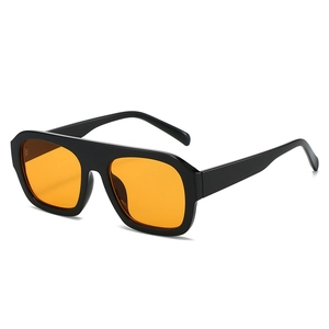 Fashionable oversized square sunglasses with black frames and vibrant orange lenses