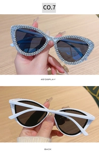 Detailed views of white cat-eye sunglasses with rhinestone edges and dark grey lenses
