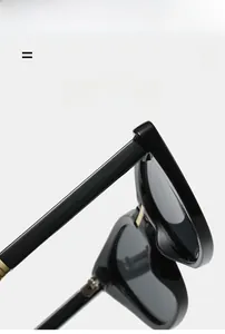 Detailed close-up of cat-eye folding sunglasses hinge with shiny metallic accents