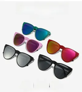 Flat lay of retro cat-eye sunglasses in multiple colors with mirrored reflective lenses