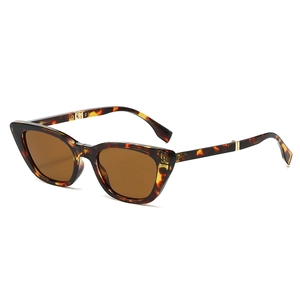 Foldable cat eye sunglasses with amber tortoise shell frames and dark brown lenses