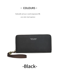 Détail du portefeuille long noir texturé cuir avec sa dragonne tressée marron