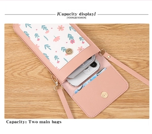 Pink crossbody phone bag with two main compartments and floral print detail
