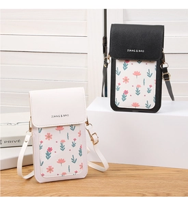 Macro detail of floral print and gold cylinder clasp on textured PU leather phone pouch