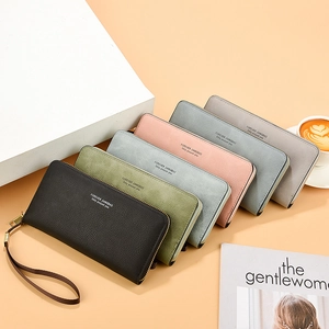 Long multi-color zip-around wallets in litchi grain texture with wrist straps and gold zippers