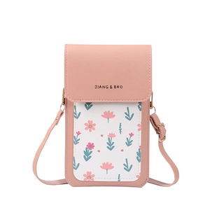 Pink crossbody phone bag with floral patterns, touch screen window, and adjustable strap