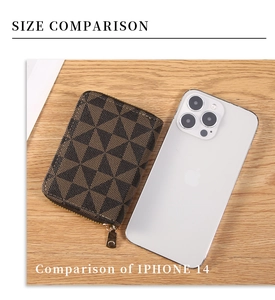 Size comparison of a geometric patterned card wallet and iPhone 14 on a wood surface