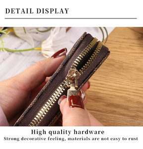 Detailed macro view of the checkered pattern leather texture and premium gold zipper slider