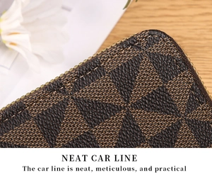 Macro detail of neat stitching on a brown checkered leather zipper card holder wallet