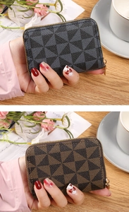 Close-up of portable zipper card wallet with geometric triangle pattern in hand