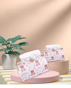 Detail of pink and white PU leather tissue boxes with cute bear pattern and metal buttons