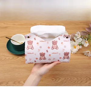 Detail of light pink PU leather tissue box featuring cute bear prints and V-shaped opening