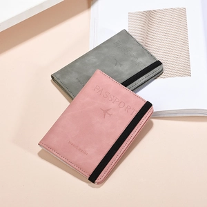 Pink and grey PU leather RFID passport covers with elastic straps and travel icons