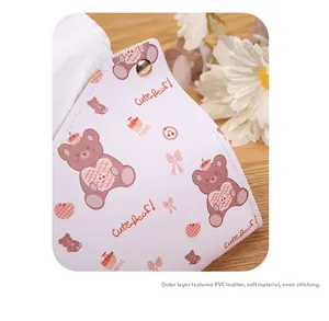 Detail of cute bear printed PVC leather tissue box with premium golden button and stitching