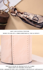 Detail of pink PU leather mini coin purse with gold zipper and floral silk ribbon accessory