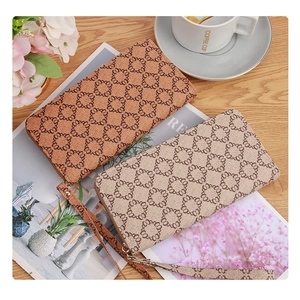 Brown and beige vintage monogram zip-around long wallets with wrist straps for women