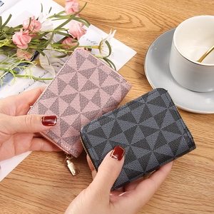 Fashionable zippered card holder and coin purse with geometric print in pink and charcoal
