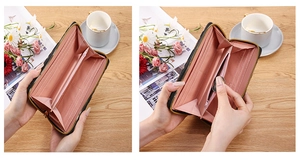 Detail view of the black zip-around wallet featuring pink interior and multi-card slots