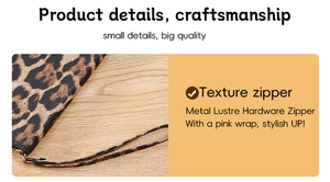 Detailed macro view of high-quality metal zipper and leopard print texture on wallet