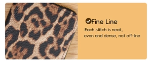 Detail of fine stitching and zipper on the leopard print wallet with leather texture
