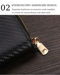 Detail of high-quality gold zipper on black straw pattern texture short wallet