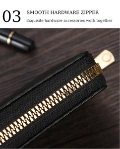 Detailed macro view of the smooth golden hardware zipper on black crossgrain leather