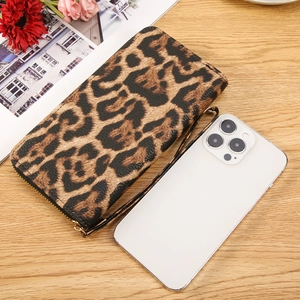 Long leopard print wallet with wrist strap and zipper, showing large phone capacity